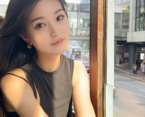 An image of Yixin Li, a young woman of Asian heritage with long dark hair.